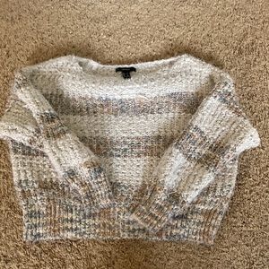 Size small, mainly polyester, white tan and light blue, horizontal stripes.